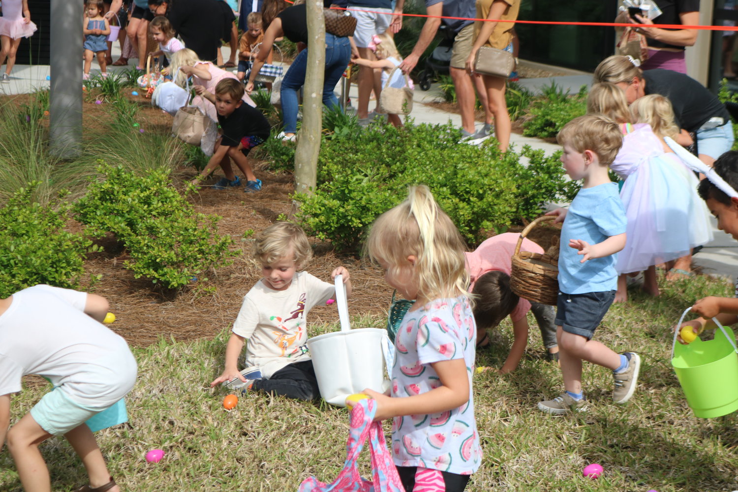 Children search for eggs during the Easter egg hunt.